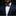 Man wearing a navy suit with a patterned bow tie and brown pocket square on a black background