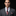 Man wearing a Red and Brown black patterned tie