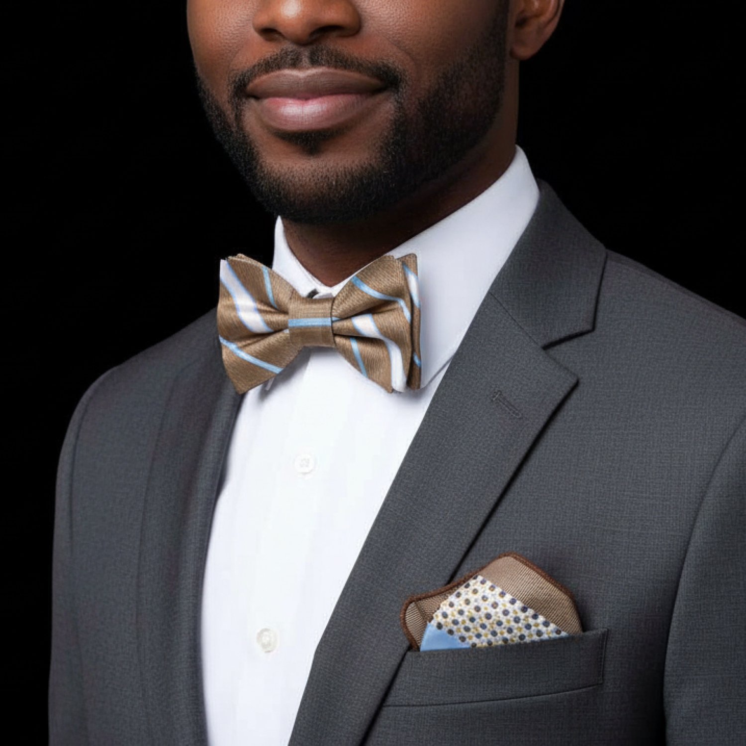 Man wearing a brown, white and light blue stripe bow tie and accenting square 