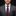 Man wearing a gray suit with a polka dot tie and pocket square on a black background