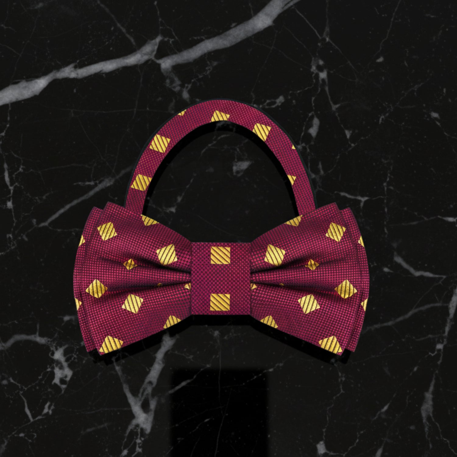 Red bow tie with yellow geometric pattern on a white background