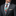 Man wearing a gray suit with a colorful tie and white shirt on a black background