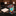 Colorful tie with abstract design next to a plain beige square on a marble surface