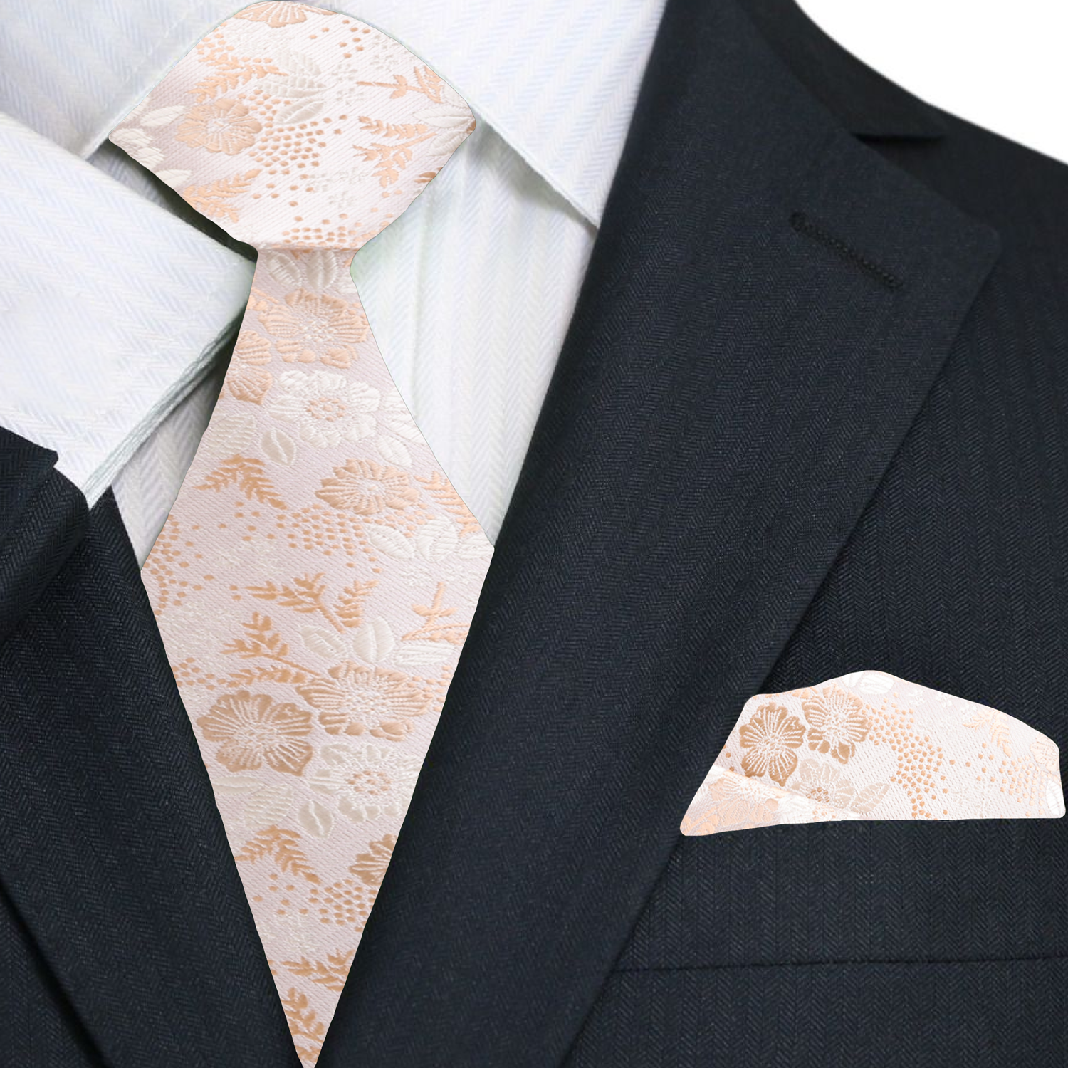 Black suit with a white shirt, beige floral tie, and matching pocket square.