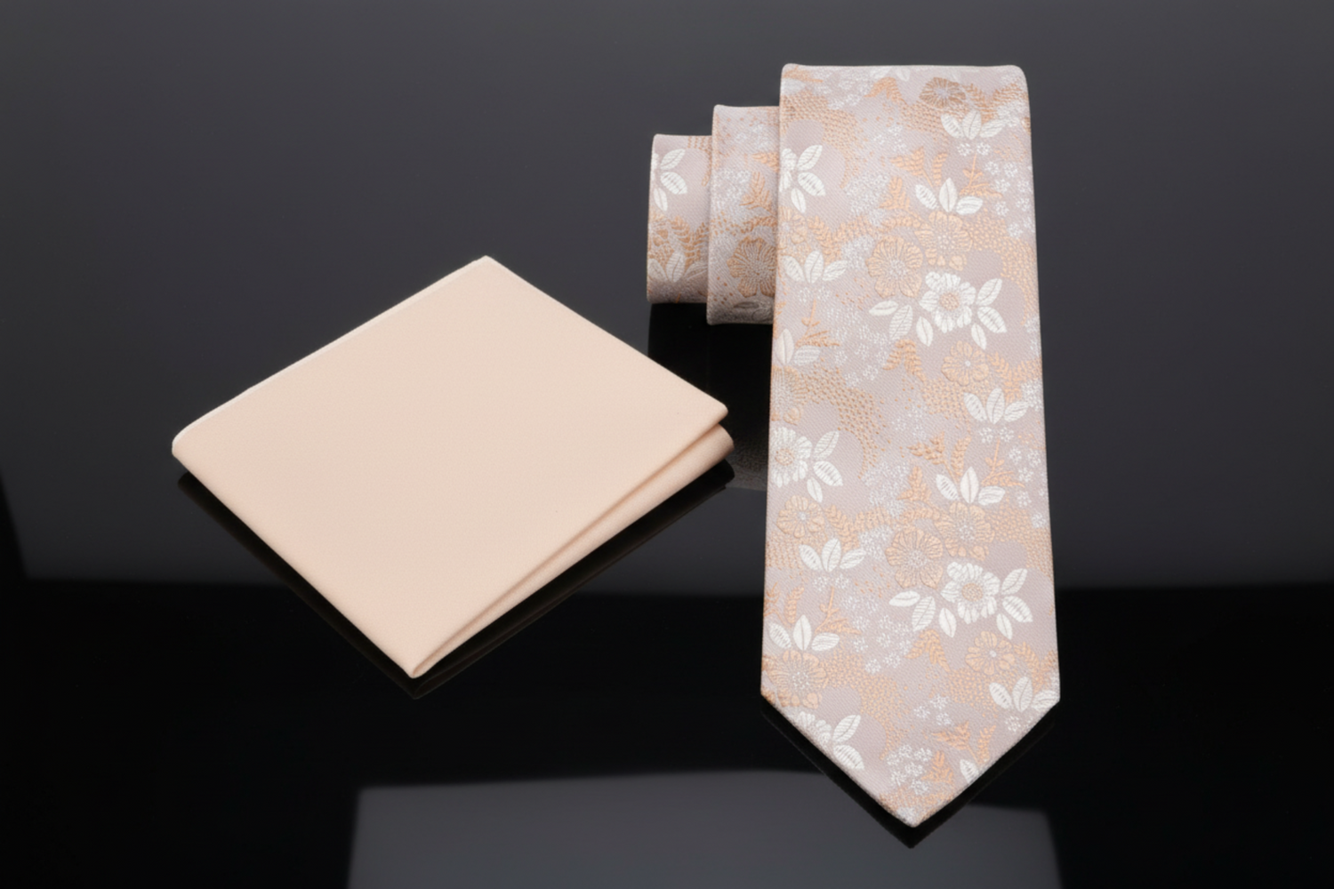 Brown Floral-patterned tie and matching pocket square on a white background