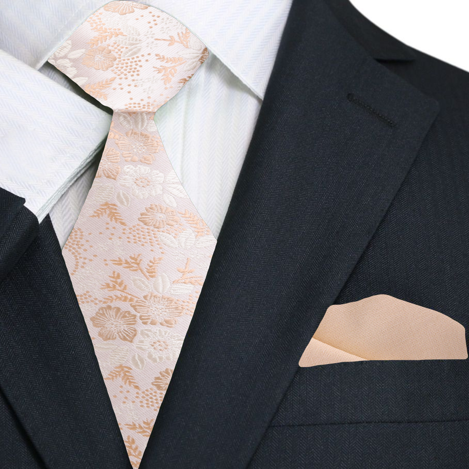 Black suit with a white shirt, beige floral tie, and matching pocket square.
