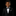 Young boy in a black suit with a bow tie on a black background