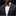 Man wearing a black suit with a white shirt and patterned bow tie on a black background