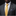Man wearing a gray suit with a yellow tie and patterned pocket square on a black background