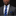 Man wearing a gray suit with a blue striped tie and pocket square on a black background