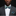 Man wearing a gray suit with a floral bow tie and pocket square on a black background
