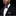Man wearing a black suit with a purple bow tie and matching pocket square on a black background