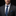 Man wearing a dark suit with a blue plaid tie and pocket square on a black background