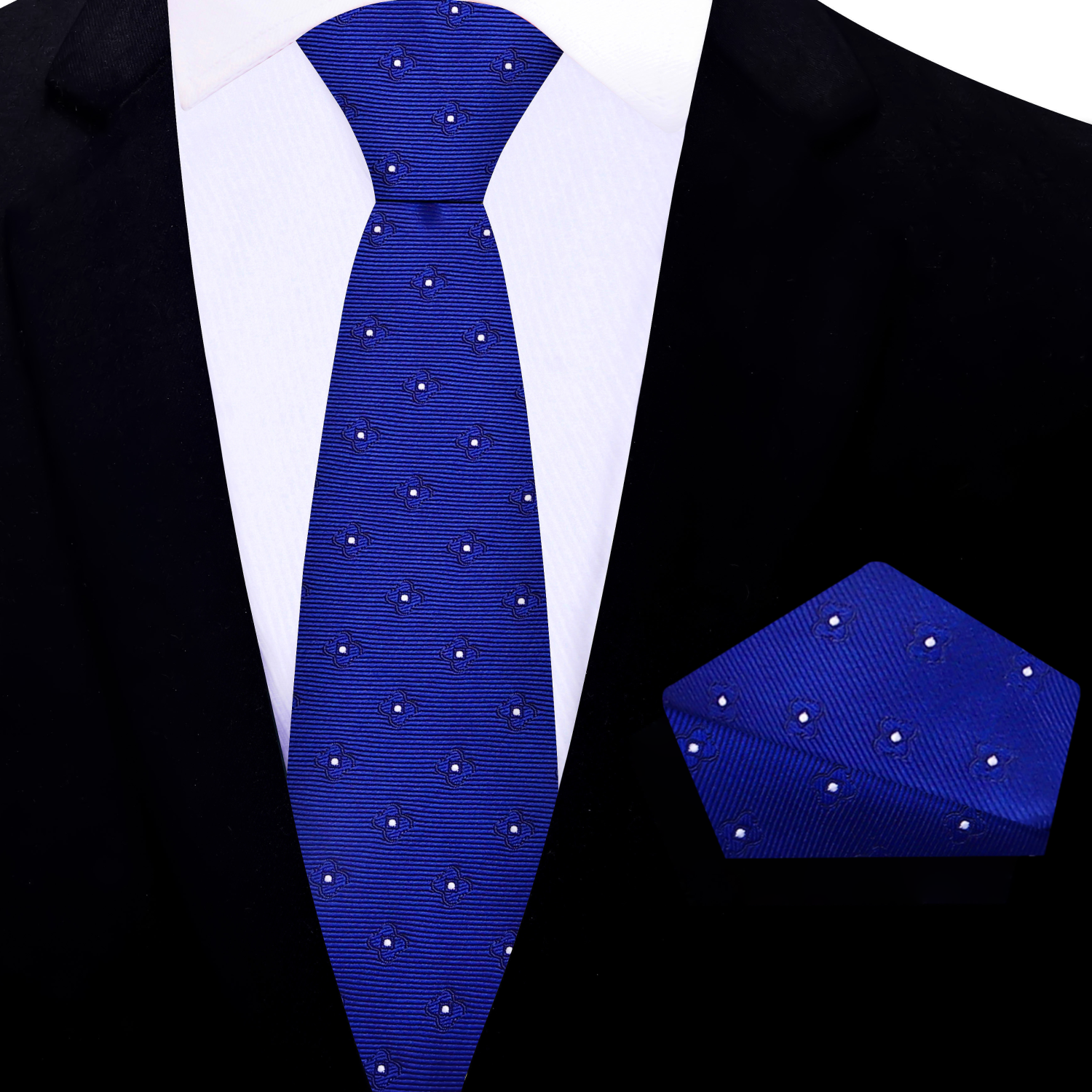Blue floral thin tie and matching pocket square set on a black suit jacket.