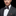 Man wearing brown stripe bow tie and square