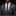 Man wearing a gray suit with a polka dot tie and pocket square on a black background