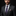 Man wearing a dark suit with a purple tie and pocket square against a black background