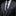 Gray suit with a purple plaid tie and pocket square on a black background
