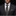 Man wearing a black suit with a patterned tie and pocket square against a dark background