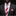 Man wearing a dark suit with a red and beige striped tie and matching pocket square.