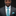 Man wearing a gray suit with a blue patterned tie and pocket square on a black background