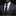 Man wearing a gray suit with a purple paisley tie and purple pocket square on a black background