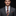 Man wearing a gray suit with a colorful tie and pocket square on a black background