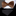 A houndstooth pattern bow tie in shades of gold and gold displayed on a white background, with a matching pocket square visible.