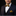 Man wearing gold and black diamonds bow tie and square