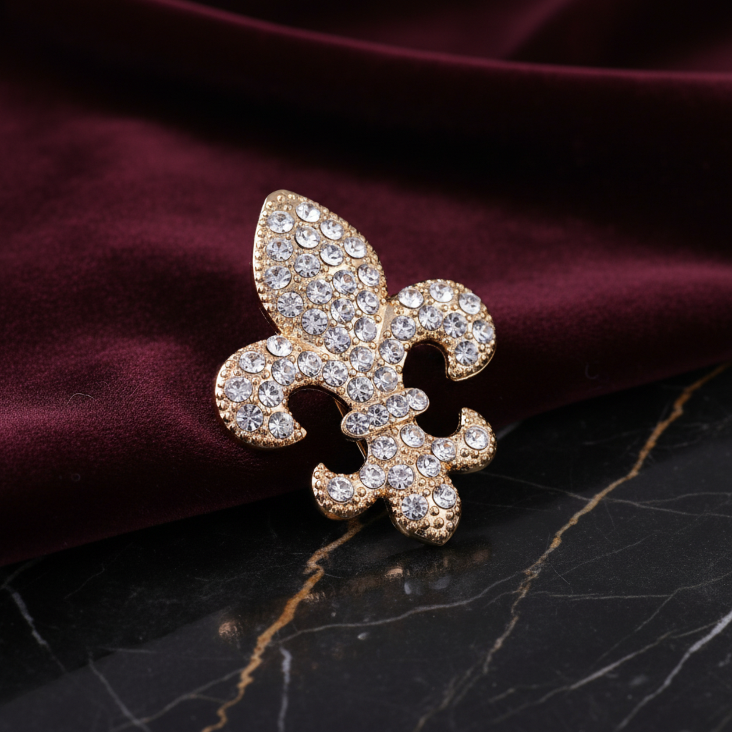 Gold and crystal fleur-de-lis brooch  