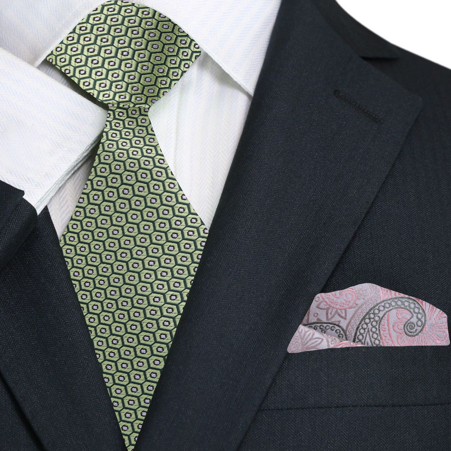 Green patterned tie and pink paisley pocket square on a black suit jacket.