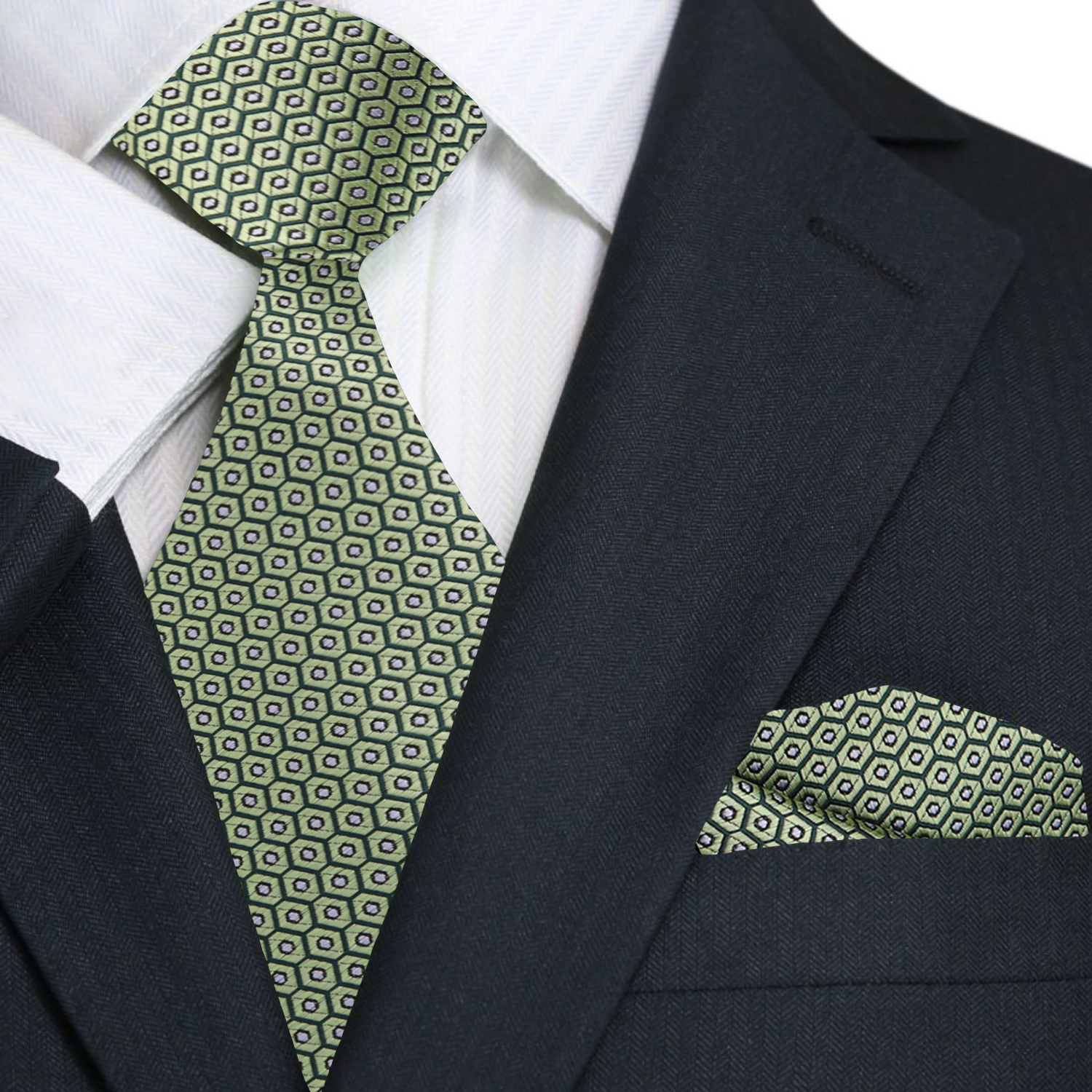 Green patterned tie and pocket square on a black suit jacket with white shirt
