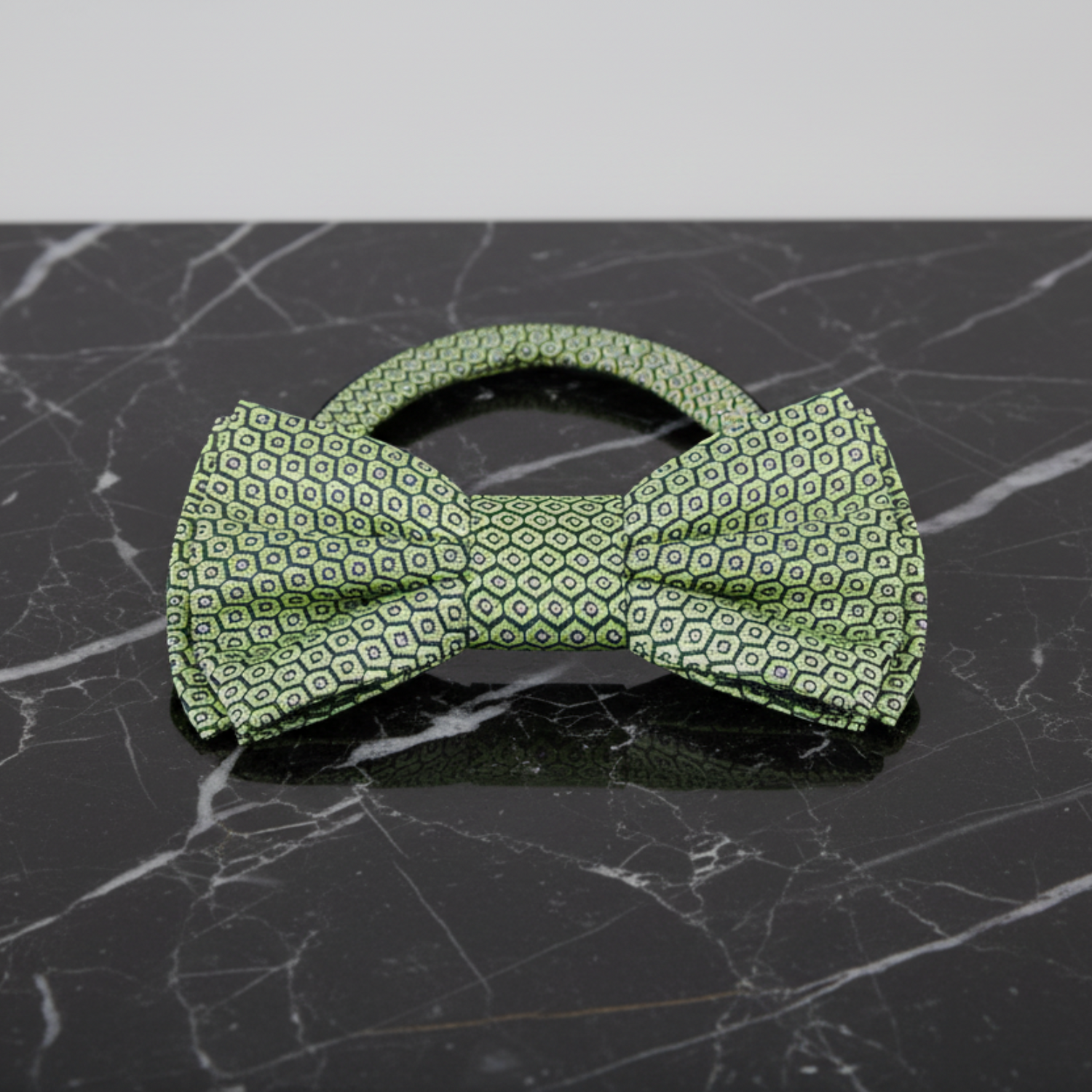A green geometric bow tie pre tied