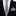 Green patterned thin tie and pocket square set on a black suit jacket.