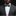 Man wearing a gray suit with a green patterned bow tie and pocket square on a black background