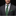 Man wearing a gray suit with a green paisley tie and pocket square on a black background
