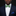 A green and blue check pattern bow tie displayed above a white shirt collar, paired with a blue pocket square.
