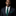 Man wearing a dark suit with a green polka dot tie and pocket square on a black background