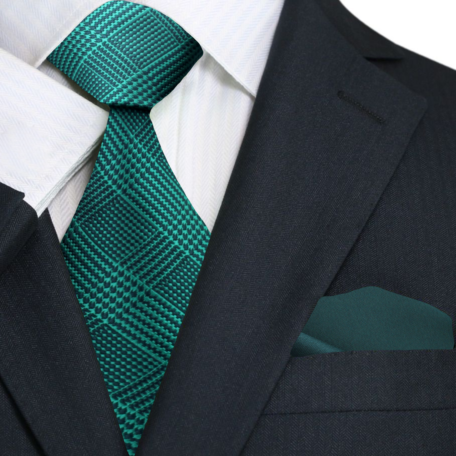 Green patterned tie and pocket square with a black suit jacket