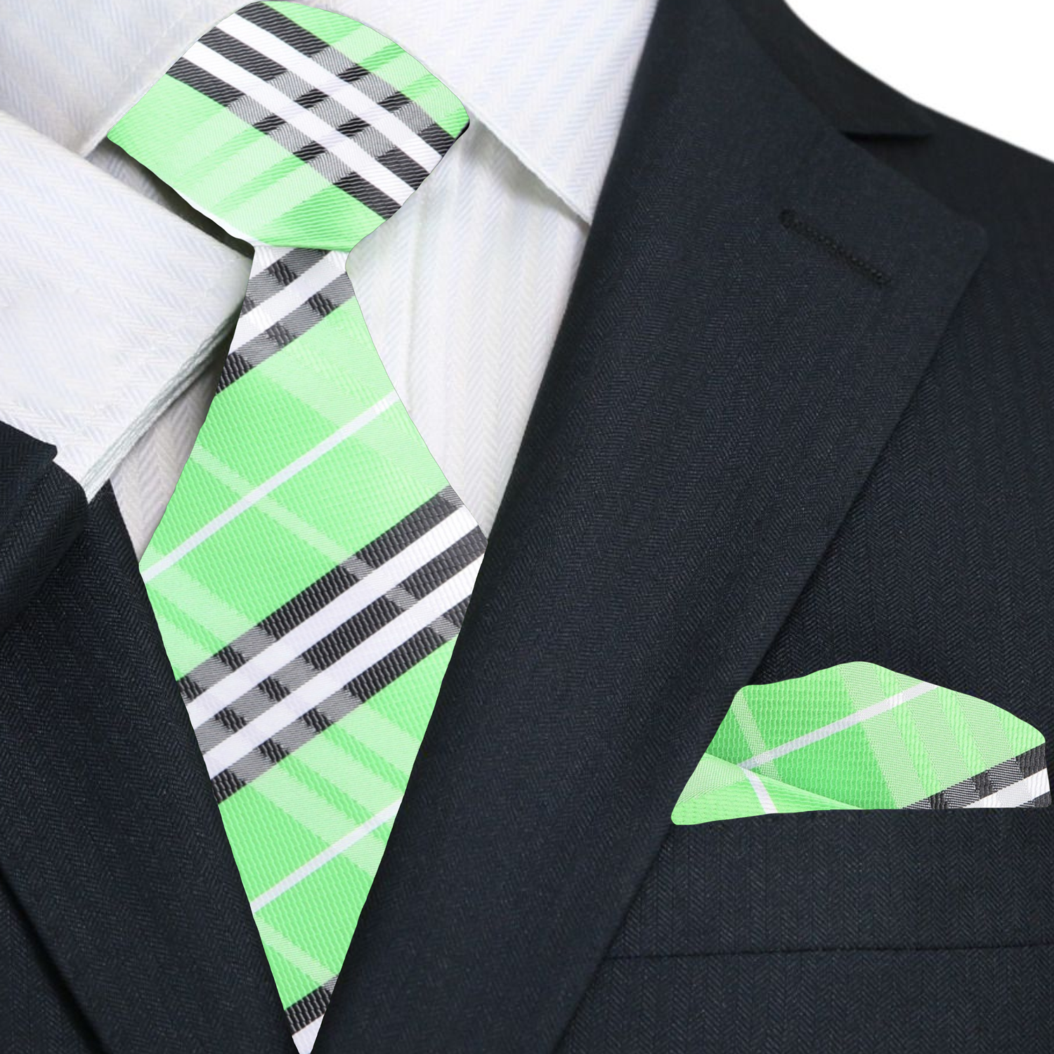 Green plaid tie and pocket square with a black suit jacket