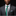 Man wearing a gray suit with a green tie against a black background