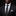 Man wearing a black suit with a patterned tie and pocket square on a dark background