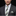 Man wearing green blocks tie and matching square with suit