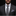 Man wearing a gray suit with a patterned tie and pocket square on a black background