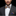 Man wearing grey blue and gold stripe bow tie and accenting square on suit