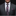 Man wearing a gray suit with a patterned pink and purple tie and pocket square.