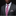 Man wearing a gray suit with a pink patterned tie and pocket square on a black background