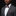 Man wearing a gray suit with a colorful bow tie and pocket square on a black background