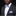 Man wearing a black suit with a white shirt, purple bow tie, and matching pocket square against a black background.