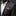 Man wearing a gray suit with a red paisley pocket square against a dark background